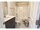 Bathroom with gray vanity, quartz countertop, and a shower/tub combo at 169 Running Deer Dr, Louisburg, NC 27549