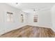Bright bedroom with hardwood floors, ceiling fan, and a door to the outside at 169 Running Deer Dr, Louisburg, NC 27549