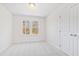 This bedroom features neutral carpet, two windows, and a closet at 169 Running Deer Dr, Louisburg, NC 27549