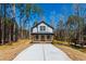 Charming two-story home with a welcoming front porch and long driveway at 169 Running Deer Dr, Louisburg, NC 27549