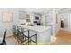 Modern kitchen with white cabinets and a peninsula at 169 Running Deer Dr, Louisburg, NC 27549