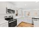 Bright kitchen featuring stainless steel appliances and quartz countertops at 169 Running Deer Dr, Louisburg, NC 27549