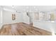 Open-concept living space with modern lighting and hardwood floors at 169 Running Deer Dr, Louisburg, NC 27549