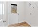 A clean mud room features a door with window to backyard and visible washer and dryer hookups at 169 Running Deer Dr, Louisburg, NC 27549