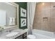 Clean bathroom with single sink, granite countertop, and bathtub at 2301 Beeblossom Pl, Fuquay Varina, NC 27526