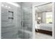 Modern bathroom featuring a glass shower enclosure and built-in seat at 2301 Beeblossom Pl, Fuquay Varina, NC 27526