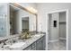 Elegant bathroom with double sinks, granite countertop, and walk-in shower at 2301 Beeblossom Pl, Fuquay Varina, NC 27526