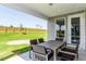 Relaxing patio with table and chairs, perfect for outdoor dining at 2301 Beeblossom Pl, Fuquay Varina, NC 27526