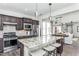 Open concept kitchen with large island, stainless steel appliances, and breakfast bar at 2513 Shorebird Dr, Fuquay Varina, NC 27526