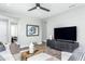 Living room with comfortable seating and a large flat screen TV at 2513 Shorebird Dr, Fuquay Varina, NC 27526
