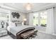 Spacious main bedroom with large windows and en-suite bathroom at 2513 Shorebird Dr, Fuquay Varina, NC 27526