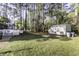Expansive backyard featuring a shed and lush trees creating a private oasis at 3540 Chelsea Dr, Rocky Mount, NC 27803