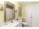 Bright bathroom with a large mirror, single sink vanity, and a shower behind a curtain at 3540 Chelsea Dr, Rocky Mount, NC 27803
