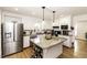 Spacious kitchen features granite countertops, white cabinetry, and stainless steel appliances at 3540 Chelsea Dr, Rocky Mount, NC 27803