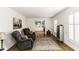 Spacious living area with hardwood floors, built-in shelving, and ample natural light at 3540 Chelsea Dr, Rocky Mount, NC 27803