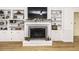 Spacious living room with a white brick fireplace and built-in shelving for decor and storage at 3540 Chelsea Dr, Rocky Mount, NC 27803