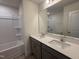 Bathroom with double vanity, granite countertop, and bathtub at 6340 Lady Eliza Ln, Raleigh, NC 27610