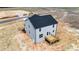 Aerial view of a two-story home with wooden deck and light blue siding at 9133 Phoenix Ct, Middlesex, NC 27557