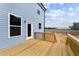 Wooden back deck with blue vinyl siding at 9133 Phoenix Ct, Middlesex, NC 27557