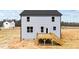 Two-story home exterior with a wooden deck and light blue siding at 9133 Phoenix Ct, Middlesex, NC 27557
