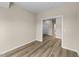 Bedroom featuring wood-look floors, neutral paint, and trim at 9133 Phoenix Ct, Middlesex, NC 27557