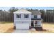 Charming two-story home with blue siding, white trim, and an attached two-car garage at 9133 Phoenix Ct, Middlesex, NC 27557