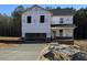 Two-story house under construction with a large driveway and landscaping at 9133 Phoenix Ct, Spring Hope, NC 27882