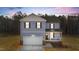 Charming two-story home with blue siding, white trim, and an attached two-car garage at 9133 Phoenix Ct, Middlesex, NC 27557