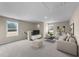 Upstairs living area with plush seating, a TV area, and plenty of space for entertaining guests at 9133 Phoenix Ct, Middlesex, NC 27557
