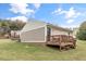 View of backyard featuring wooden deck and siding on exterior of the home at 1320 S State Street # D, Raleigh, NC 27610