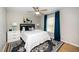 Bedroom with a comfortable bed, side tables, and a large window at 1320 S State Street # D, Raleigh, NC 27610