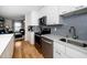 Updated kitchen featuring stainless steel appliances and white cabinets at 1320 S State Street # D, Raleigh, NC 27610