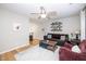 Comfortable living room with a ceiling fan, hardwood floors, and a modern decor at 1320 S State Street # D, Raleigh, NC 27610