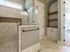 Modern bathroom featuring a glass-enclosed shower, tiled walls, and built-in shelving at 142 Batten Hill Ln, Selma, NC 27576