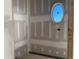 Bathroom with an oval window, drywall and framing, ready to be transformed at 142 Batten Hill Ln, Selma, NC 27576