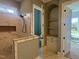 Bathroom with a marble tiled shower with niche, and an alcove with shelves and storage at 142 Batten Hill Ln, Selma, NC 27576