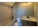 Bathroom featuring a tiled shower and bathtub, a toilet, and a vanity with a marble countertop at 142 Batten Hill Ln, Selma, NC 27576