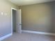Neutral bedroom with carpet flooring, natural light and an open door to a closet at 142 Batten Hill Ln, Selma, NC 27576