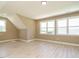 Bright bedroom with a neutral color palette, large windows, and light wood flooring at 142 Batten Hill Ln, Selma, NC 27576