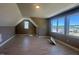 Upstairs bonus room with a vaulted ceiling and large windows offering ample sunlight and views at 142 Batten Hill Ln, Selma, NC 27576