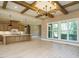Modern kitchen with a large island, custom cabinets, and stainless steel appliances at 142 Batten Hill Ln, Selma, NC 27576