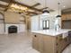 Open-concept kitchen with a large island, modern appliances, and hardwood flooring at 142 Batten Hill Ln, Selma, NC 27576