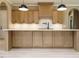 Gourmet kitchen featuring custom cabinetry, a tile backsplash, and pendant lighting at 142 Batten Hill Ln, Selma, NC 27576