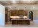 Spacious eat-in kitchen with wood cabinets, stainless steel appliances, and a large kitchen island at 142 Batten Hill Ln, Selma, NC 27576