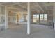 Spacious living room showcasing large windows and an open floor plan ready for customization at 142 Batten Hill Ln, Selma, NC 27576