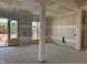 Unfinished living room with view of glass patio doors and bright natural light at 142 Batten Hill Ln, Selma, NC 27576