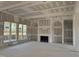 Bright, unfinished living room featuring arched built-ins and large windows, ready for personalization at 142 Batten Hill Ln, Selma, NC 27576