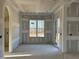Living room featuring a window and patio door, awaits your personal touch at 142 Batten Hill Ln, Selma, NC 27576