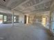 Spacious living room featuring an open floor plan with large windows, awaiting your personal touch at 142 Batten Hill Ln, Selma, NC 27576