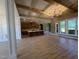 Open concept living space featuring a tray ceiling, large windows, and an eat-in kitchen at 142 Batten Hill Ln, Selma, NC 27576
